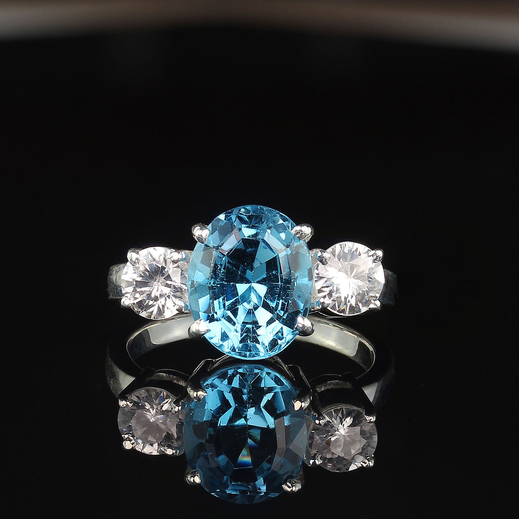 Elegant Blue Topaz and Sparkling Genuine Zircon Ring