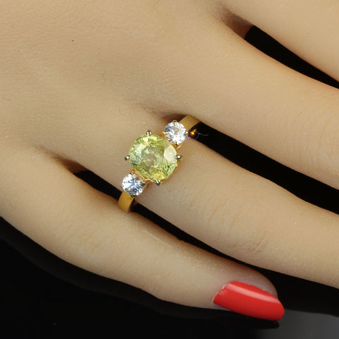 Super Oval Sphene accented with White Sapphires in Gold and Sterling Silver Ring